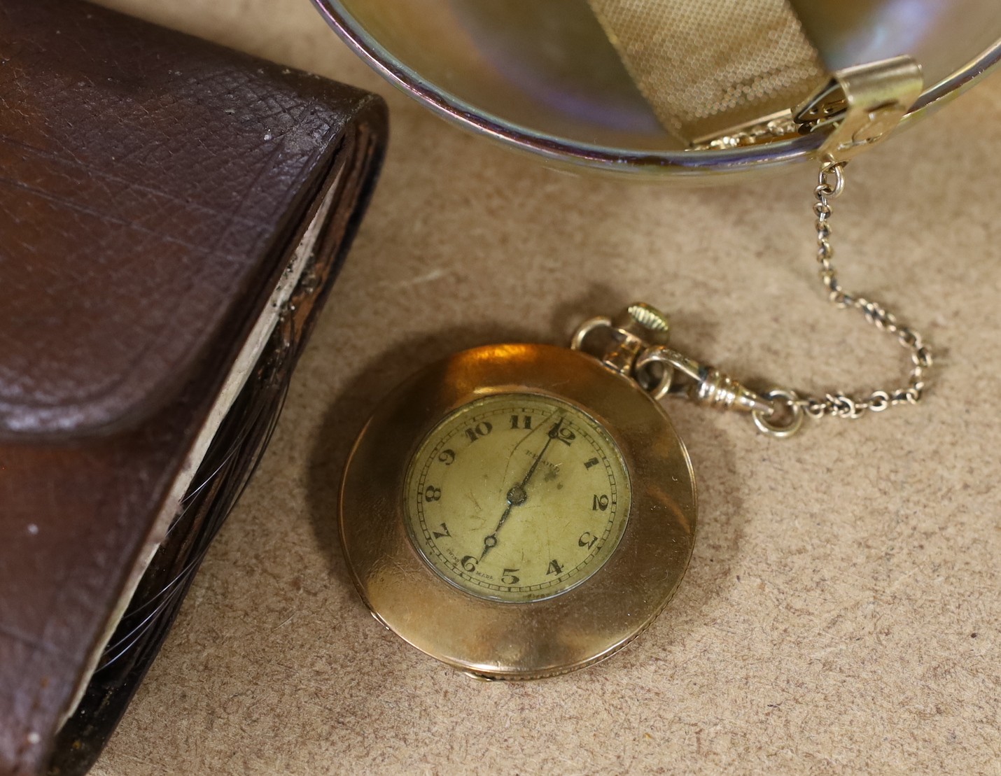 A quantity of various collectibles including a Hardys fishing wallet, a cold painted bronze ‘terrier’ mounted marble ash tray, bronze figural bell, pocket watches, Tiffany glass dish etc, dish11.5cms diameter